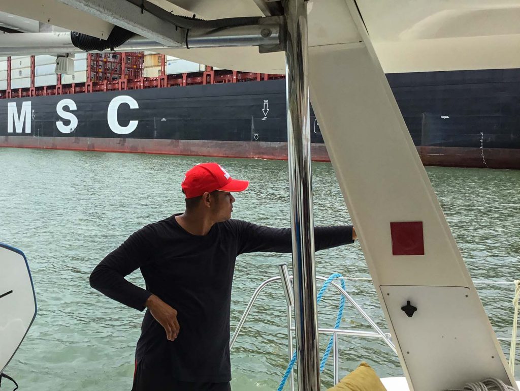 While underway (south of Lake Gatun) this freighter passes with our trusty line handler looking on.